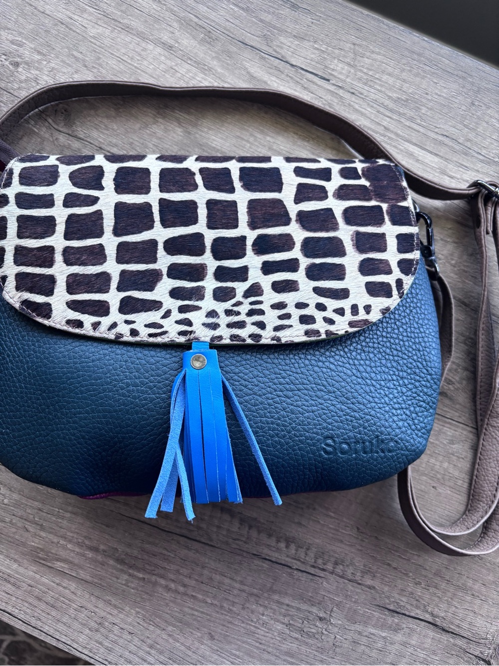 Soruka Lola dual reversible flap Pebbled teal and green bag with blue tassel